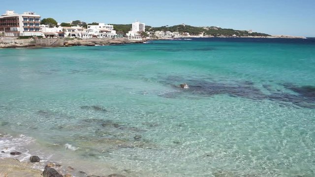 Beautiful seaside of Cala Ratjada, soft waves at beach Son Moll Mallorca, Mediterranean Sea Spain