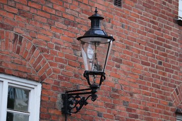 beautiful old lamp on the house wall
