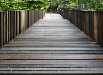 Naklejka na ściany i meble Wooden bridge in the park