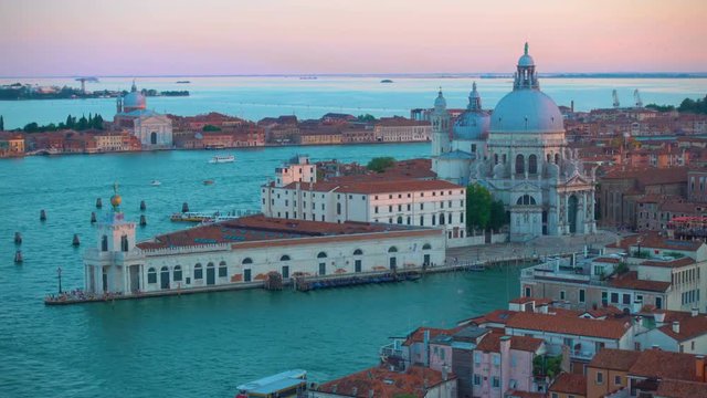 The Grand Canal and Santa Maria della Salute church in Venice in the early evening - panoramic view from above, Italy