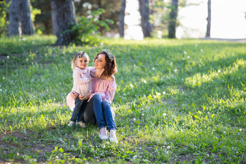Fototapeta premium Mom and daughter are two years