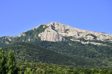 mountain, rock, landscape, sky, nature, mountains, blue, tree, hill, stone, green, forest, travel, cliff, view, summer, rocks, panorama, sea, peak, scenic, high, outdoors, trees, greece