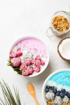 Pink And Blue Smoothie In Bowl With Pitaya, Strawberry And Raspberry