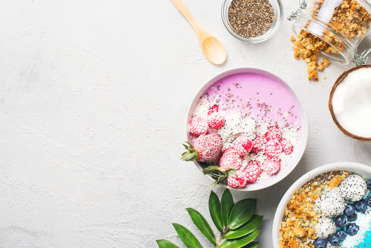 Pink And Blue Smoothie In Bowl With Pitaya, Strawberry And Raspberry