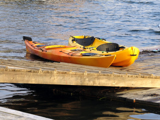 Two sports kayaks on the pier