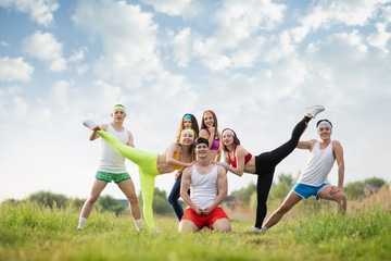 Group of sports people on the grass