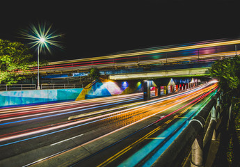 Train and car light streaks at nigh
