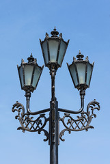 Fototapeta na wymiar Retro streetlight on blue sky background