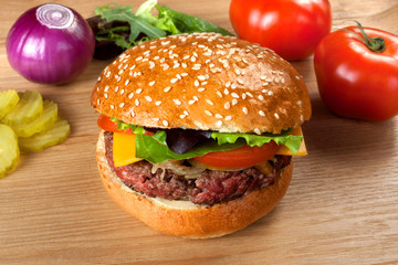 homemade hamburger with beef on a wooden table