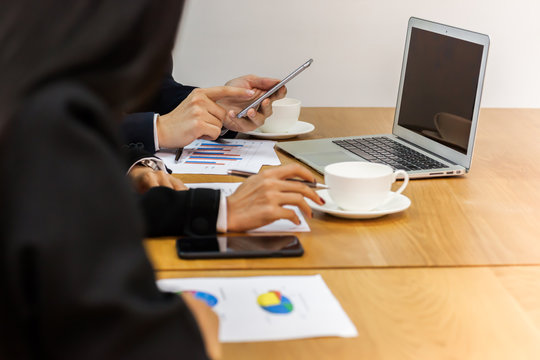 Business people are hands using mobile phone put on table