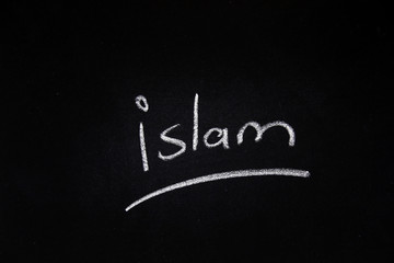  Handwritten islam word written on blackboard