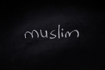  Handwritten muslim word written on blackboard