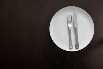 Empty Plate on Brown Wood