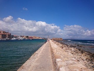 walking walls of old Venetian Harbour Chania Crete Greece