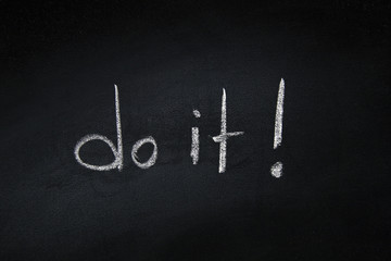  Handwritten do ir word written on blackboard