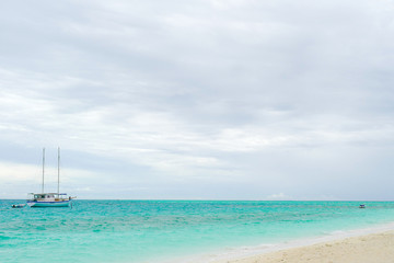 Summer concept , Boat sailing on turquoise sea color at maldives on the weekend holidays