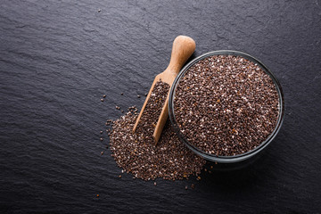chia seeds on a dark stone background