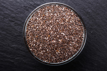 chia seeds on a dark stone background