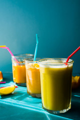 Fototapeta premium Citrus juiceDifferent citrus juce poured and drunk on jar glass.summertime concept and healthy lifestyle.