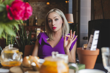 Portrait of Blonde Woman in Cafe