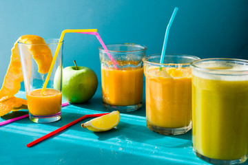 Citrus juiceDifferent citrus juce poured and drunk on jar glass.summertime concept and healthy lifestyle.