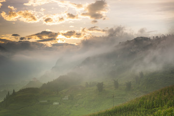  landscape view of sunrise above mountain with cloudy