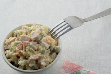 Olivier in a bowl and fork