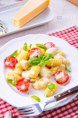 delicious gnocchi with gorgonzola cream sauce and cherry tomatoes