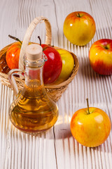 apple vinegar on a wooden rustic background