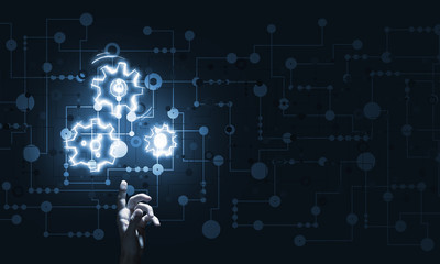 Glowing cogwheel mechanism icon on dark background as symbol of teamwork