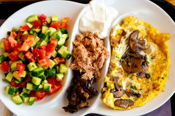 A delicious tradition Mediterranean breakfast in the port of Tel-Aviv, Israel. Selective focus.
