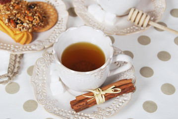retro cup with sugar and vanilla tea with cookies for breakfast