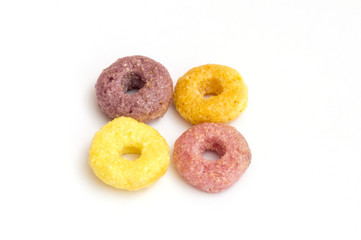 colorful cereals in the form of a circle on white background