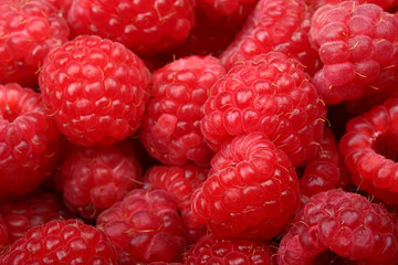 Juicy and fresh ripe raspberries close-up. Natural background