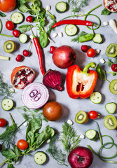 Flat lay fresh vegetables, fruits and herbs on concrete background.