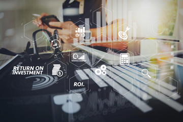 business documents on office table with smart phone and digital tablet and graph business with social network diagram and man working in the background