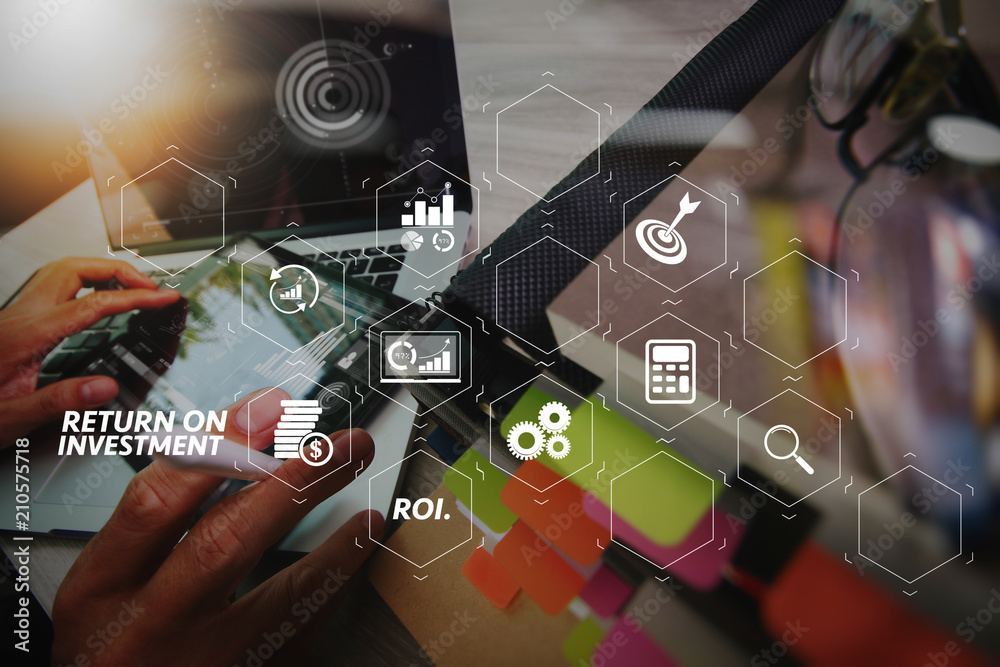 Poster business documents on office table with smart phone and digital tablet and graph business with social network diagram and man working in the background