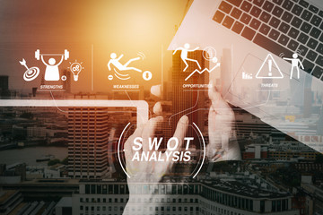 cyber security internet and networking concept.Businessman hand working with VR screen padlock icon mobile phone on laptop computer with building exposure