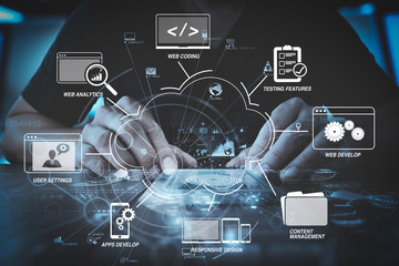 businessman hand working with modern computer in modern office with virtual icon diagram