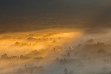Sunrise on top of mountain with foggy and clear sky 