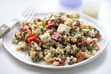 Giant couscous, feta, lentils with roasted red peppers salad