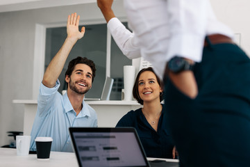 Office colleagues at the meeting table in office