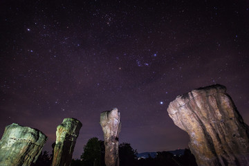 Star at nigh time with sky and milky way above on Stonehenge located chaiyaphoom province north east of Thailand 