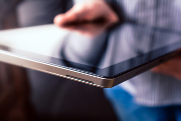 Man Holding Tablet With Reflection In His Hands