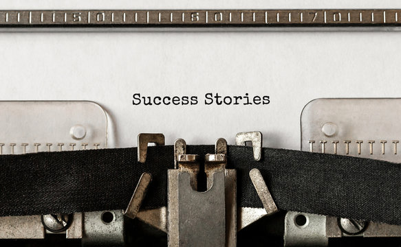 Text Success Stories typed on retro typewriter
