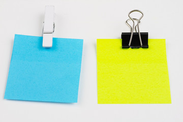 Blank colored sticky notes with clips. Office accessories for listing and memorizing on the table....