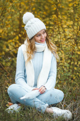 Young attractive woman in autumn colorful background