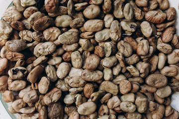 Dry beans seeds lying on rustic plate. Ecological green photo. Healthy vegetarian food. Vegan photo.