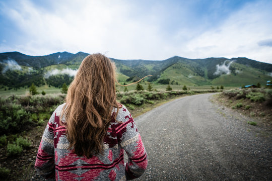 Woman Walking Or Hiking In The Mountains Long Hair 