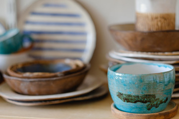 pottery handcraft hobby. assortment of handmade clay plates and jugs - obrazy, fototapety, plakaty